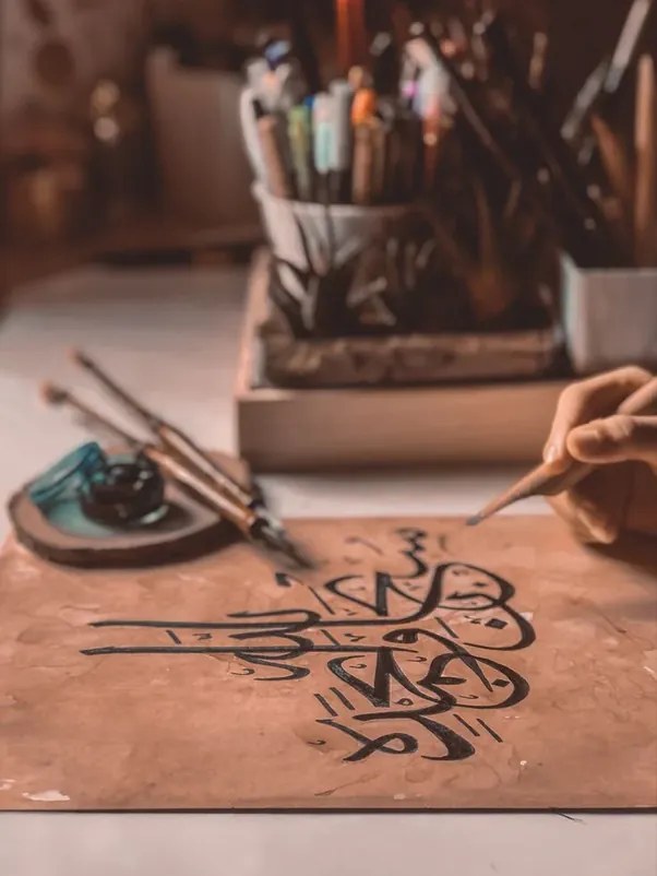 FiziArt Studio artist crafting handmade calligraphy and Persian illumination artwork